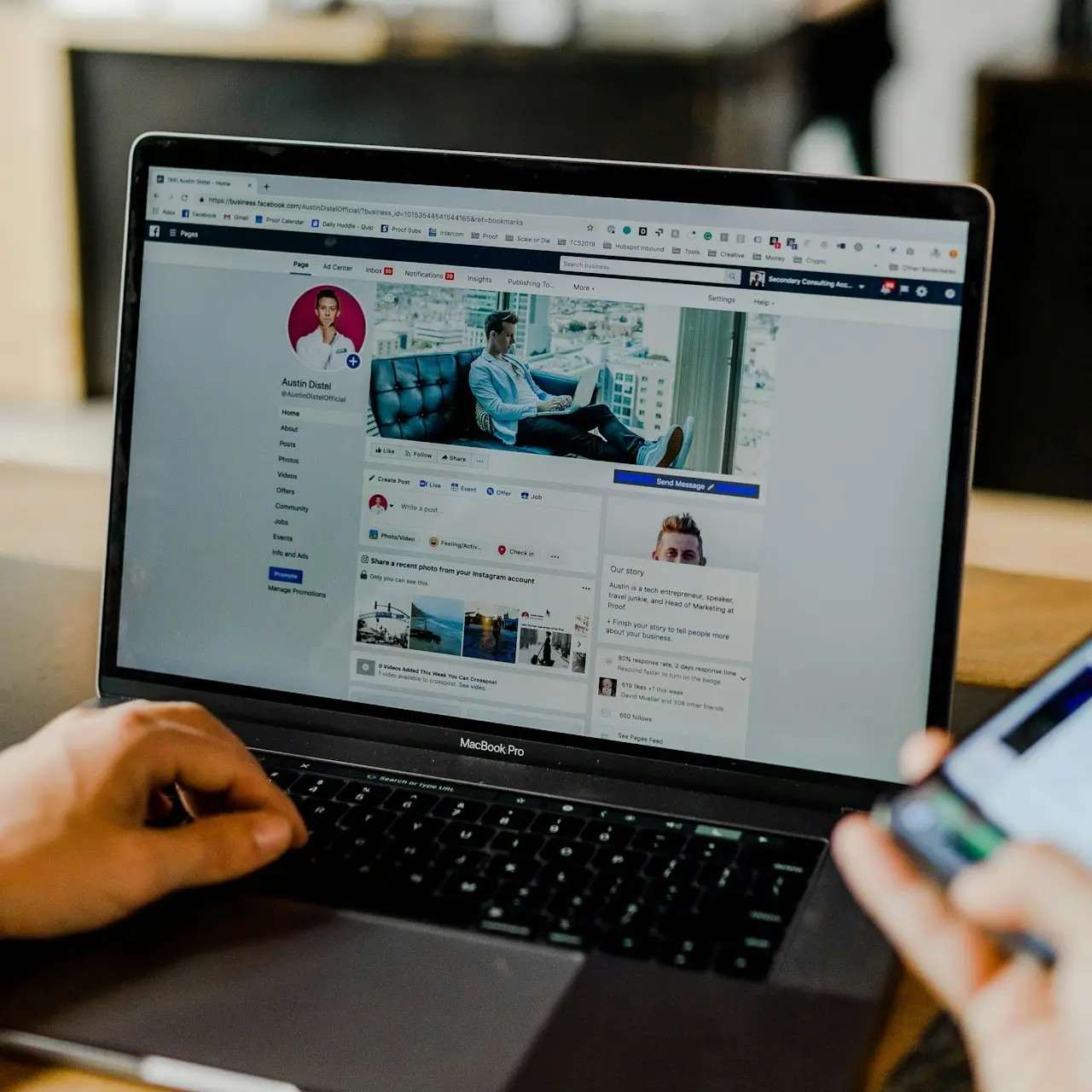 person using both laptop and smartphone